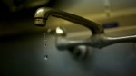 Artistic image of dripping faucet.