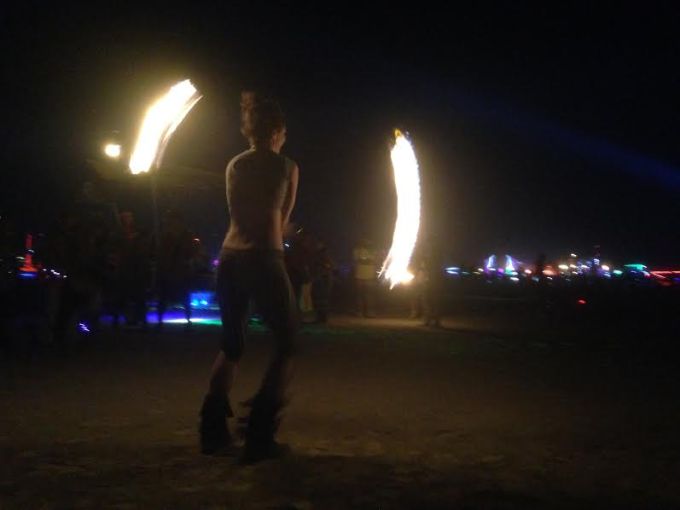Fire Dancer performs out on the playa at Black Rock City.