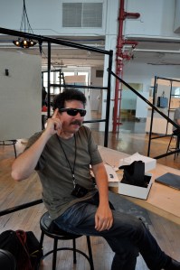 Ron Miller trying on Google Glass in New York City. With sun glasses attachment.