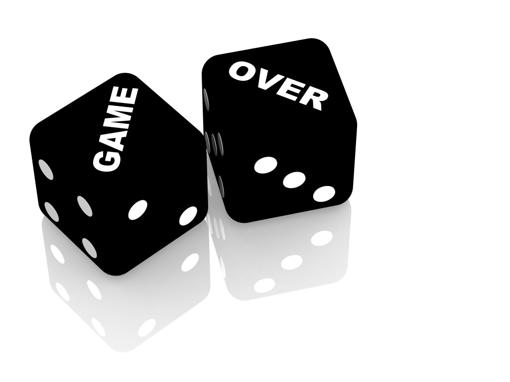 Two dice with words "Game Over" showing.