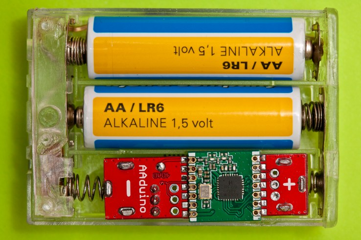 Two AA batteries and an AAduino side by side, in a display of effortless cool we haven't seen this side of Hollywood in a decade.
