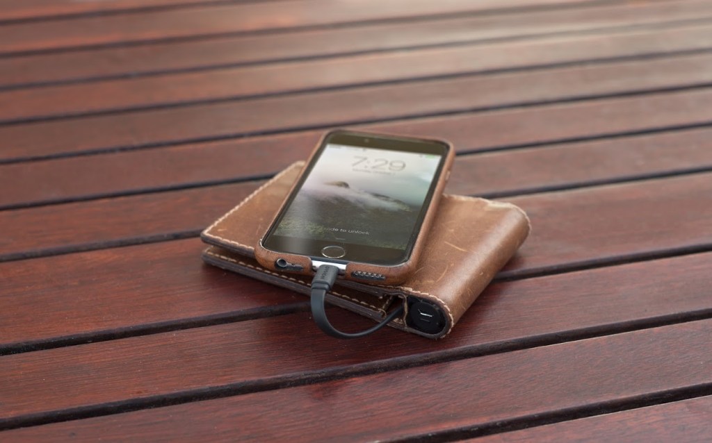 This leather wallet has a built-in battery to charge your | TechCrunch