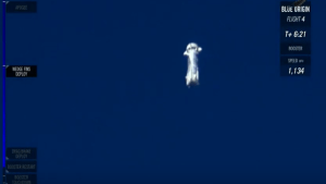 New Shepard upon descent, slowed by circular fin on the top and smaller fins along the outside / Screenshot of Blue Origin webcast