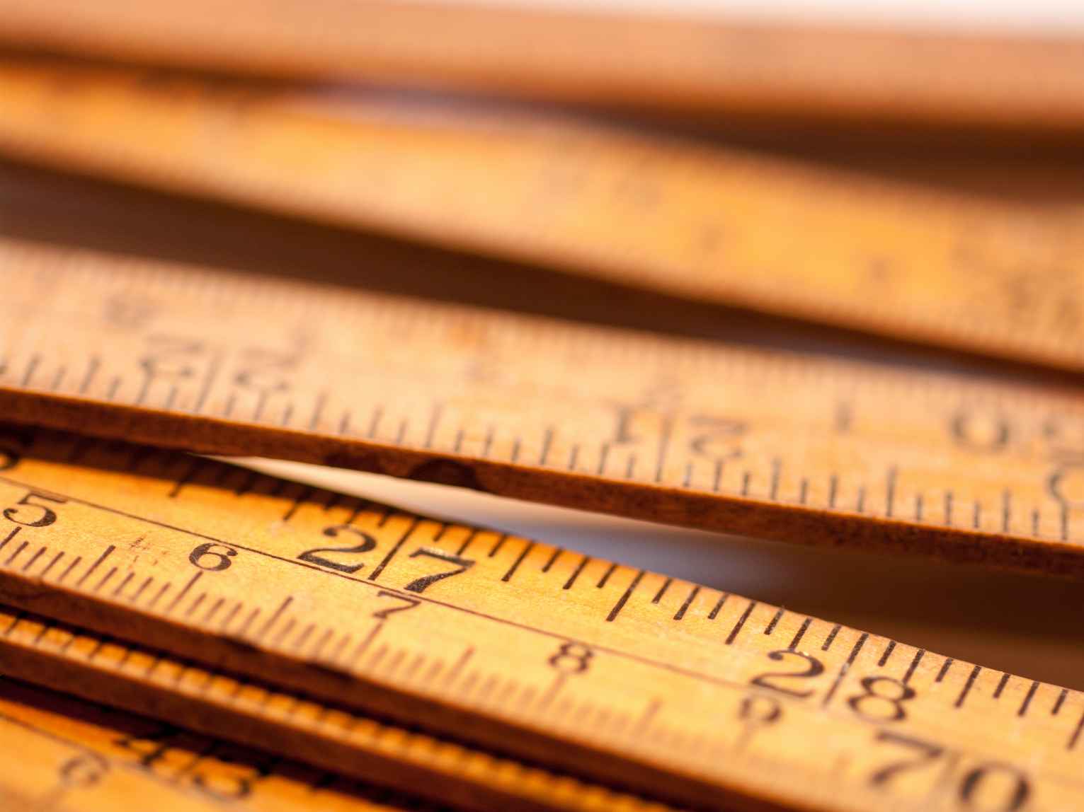 Close-Up Of Wooden Rulers On Table