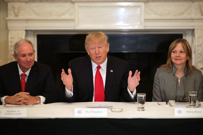 WASHINGTON, DC - FEBRUARY 03:  U.S. President Donald Trump (C) delivers opening remarks at the beginning of a policy forum with business leaders with General Motors CEO Mary Barra (R) and chaired by Blackstone Group CEO Stephen Schwarzman in the State Dining Room at the White House February 3, 2017 in Washington, DC. Leaders from the automotive and manufacturing industries, the financial and retail services and other powerful global businesses were invited to the meeting with Trump, his advisors and family.  (Photo by Chip Somodevilla/Getty Images)
