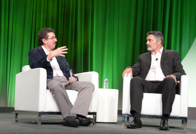 TechCrunch's Ron Miller on stage with Cloudera CEO Tom Reilly at the Intel Capital Summit in 2014.