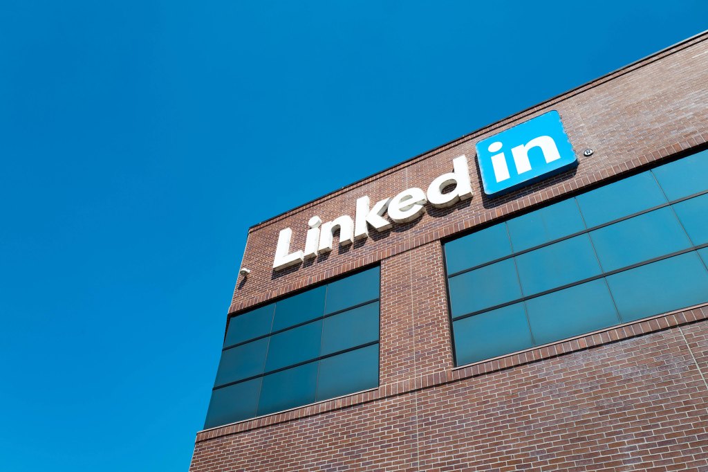 View of main building with logo and signage at the headquarters of professional social networking company LinkedIn