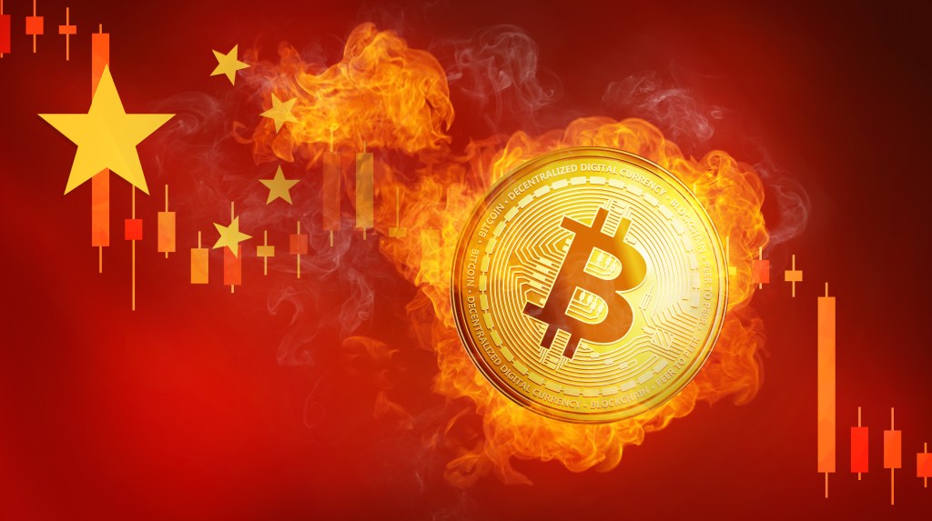 Golden bitcoin coin on China flag in fire is falling.