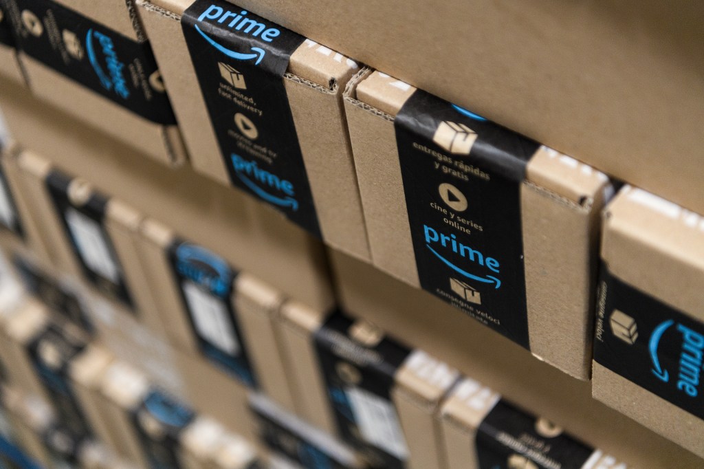 Amazon Prepares For Black Friday Sale; rows of Amazon boxes on shelves