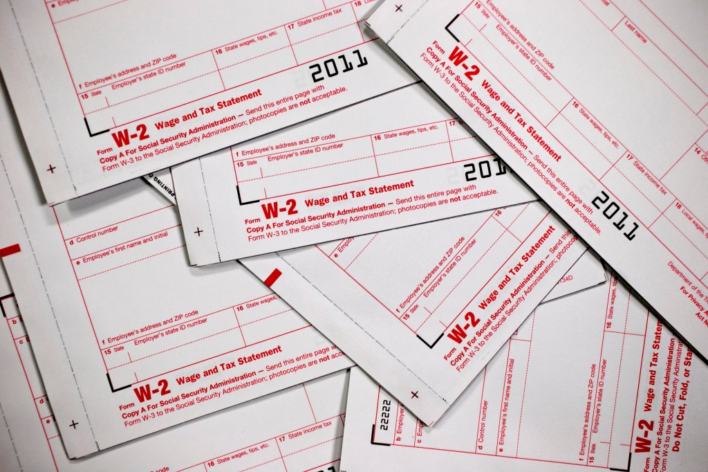 W-2 wage and tax statement forms are arranged for a photograph