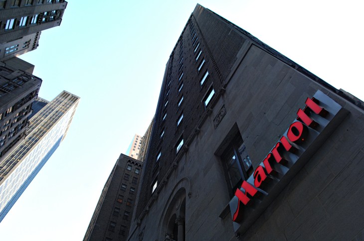 A Marriott logo hangs on the side of a hotel in New York Thu