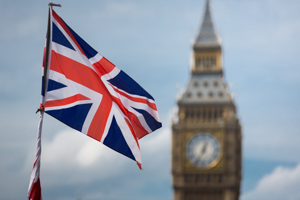 London's Big Ben clock tower and British flag