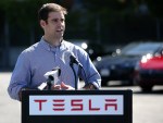 JB Straubel, Tesla Motors chief technical officer, speaks during a ribbon cutting for a new Supercharger station outside of the Tesla Factory