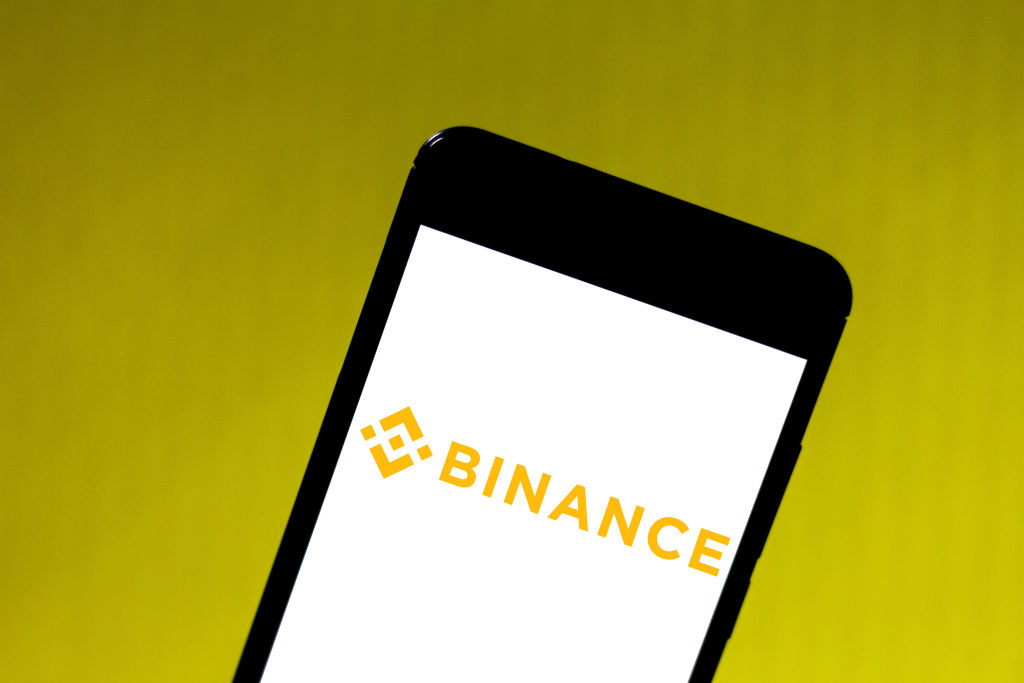 In this photo illustration, the Binance logo is visible