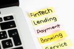 Fintech label. Fintech, lending, payment, banking service Tag cloud aside a laptop.