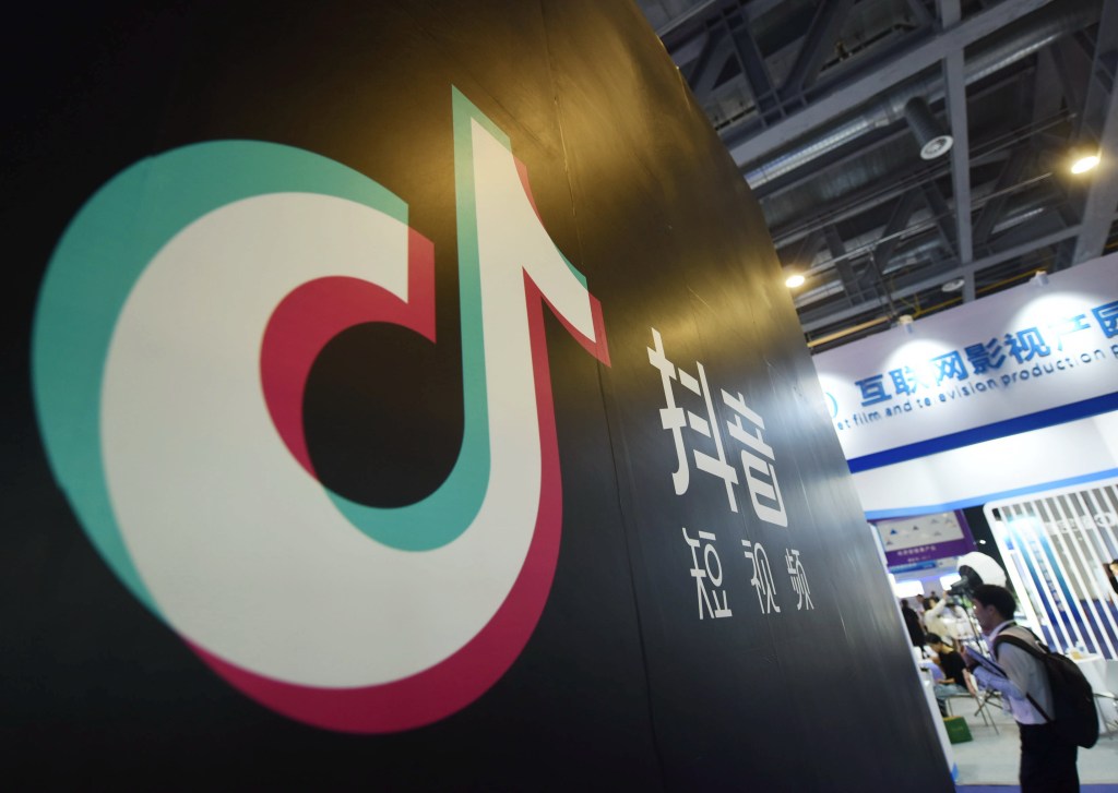 Visitors visit the booth of douyin(Tiktok) at the 2019 smart expo in Hangzhou.