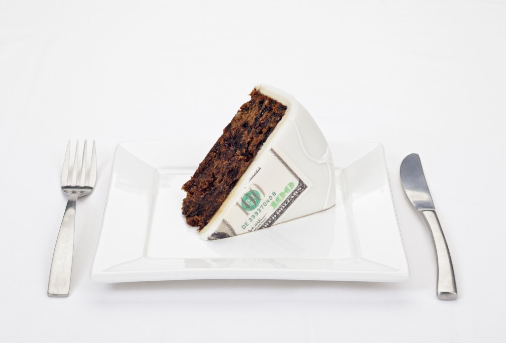 Dollar bill printed on slice of cake