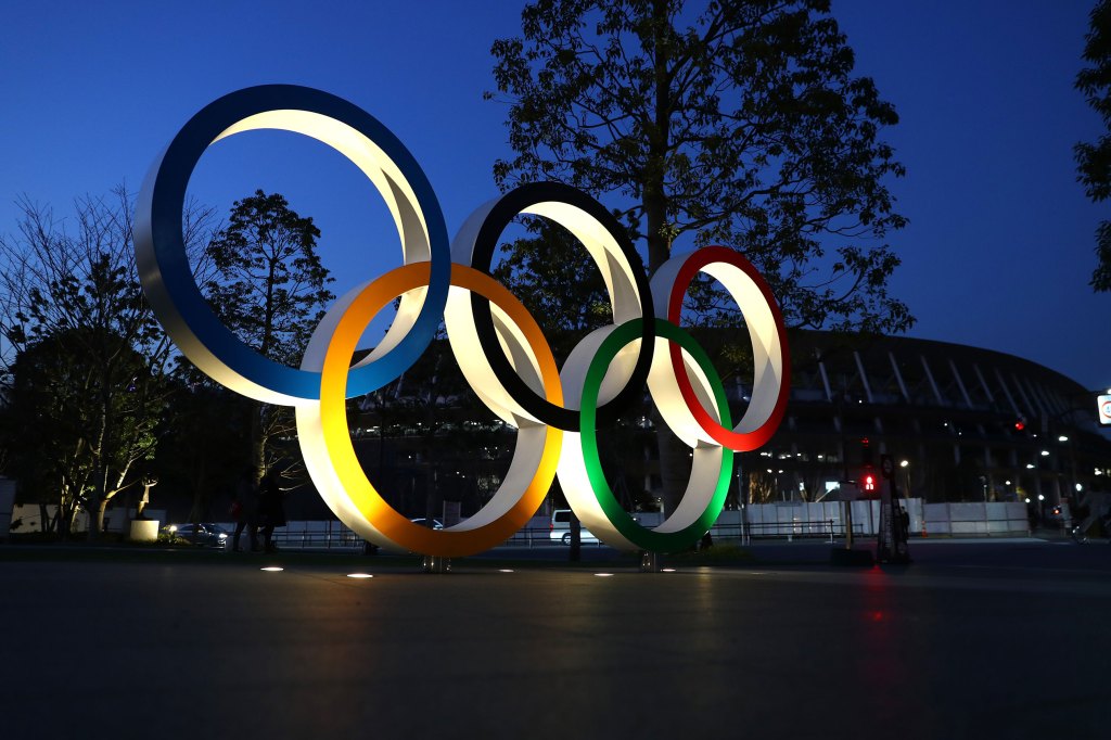 Olympic rings are seen outside the New National Stadium in Tokyo