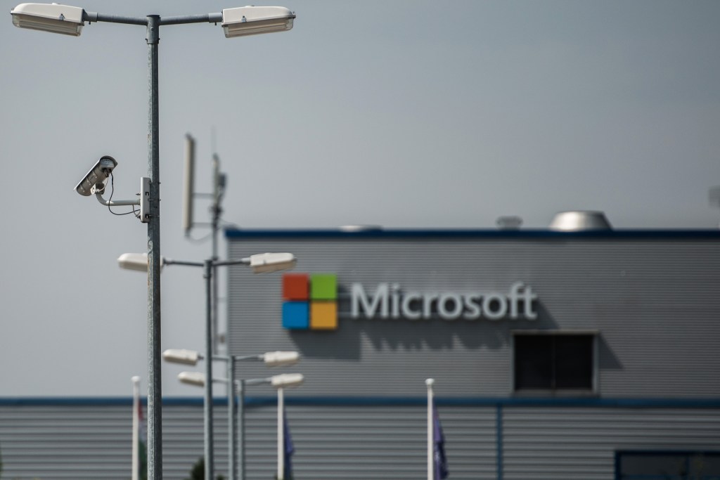 A closed circuit security camera (CCTV) operates on a lamppost at the Nokia Oyj mobile handset factory, operated by Microsoft Corp., in Komarom, Hungary, on Monday, July 21, 2014. Microsoft said it will eliminate as many as 18,000 jobs, the largest round of cuts in its history, as Chief Executive Officer Satya Nadella integrates Nokia Oyj's handset unit and slims down the software maker. Photographer: Akos Stiller/Bloomberg via Getty Images