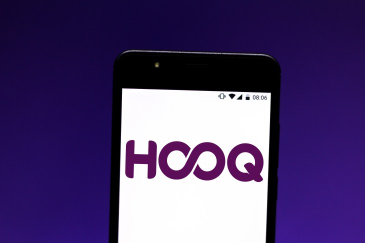 In this photo illustration a HOOQ logo seen displayed on a