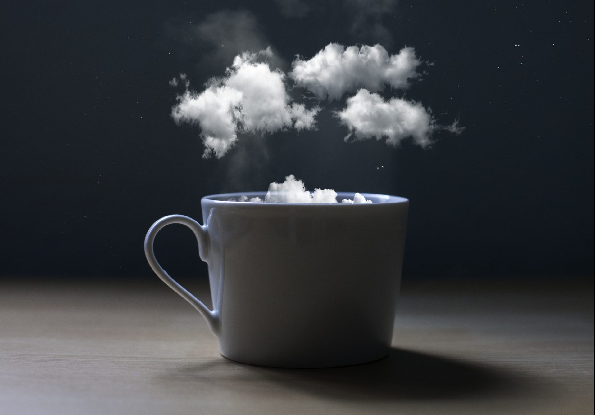 Conceptual photo of a cup with clouds. It seems to say, take a break and dream