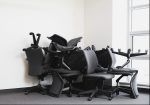 Office chairs piled in corner of empty office