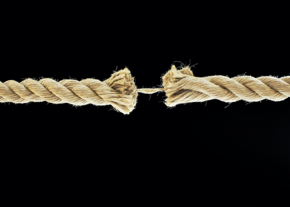 Frayed rope at breaking point, close-up.