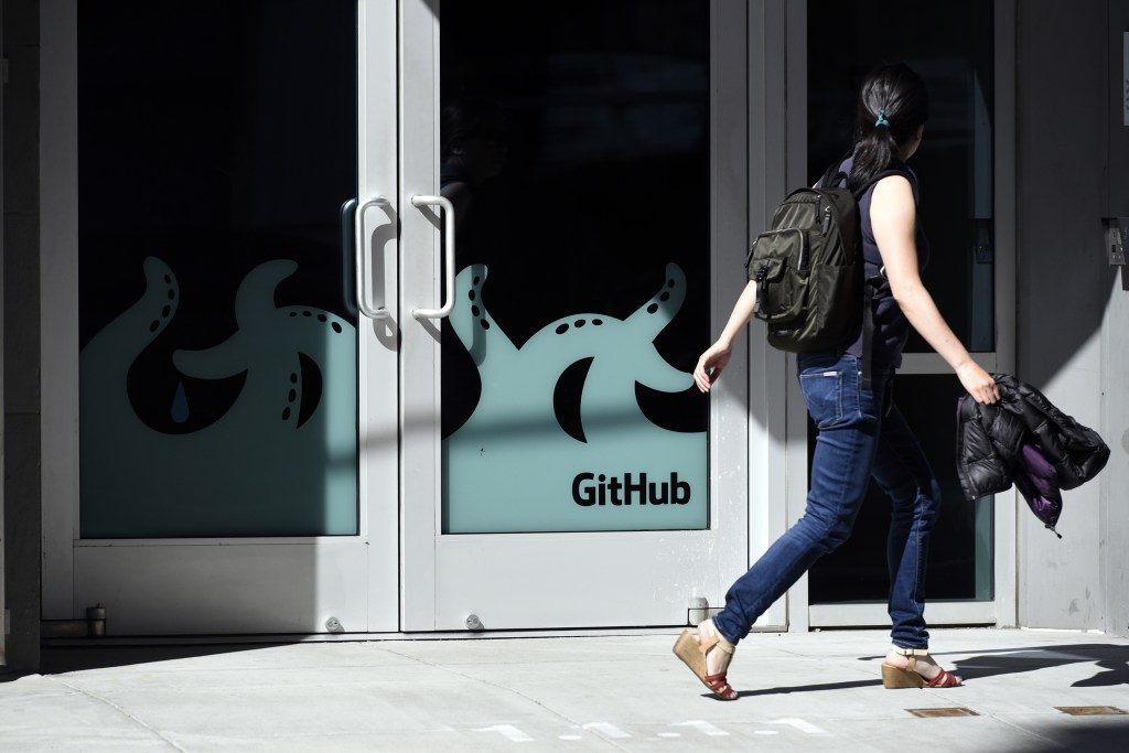A pedestrian walks past the GitHub Inc. offices in San Francisco, California, U.S., on Monday, June 4, 2018. Microsoft Corp. is buying GitHub for $7.5 billion in stock, bringing in house a community of 28 million programmers who publish code openly and extending a shift away from a strategy of shrouding its software in secrecy. Photographer: Michael Short/Bloomberg via Getty Images