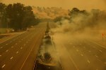 Fire burns along the closed Interstate 80 as the LNU Lightning Complex fire burns through the area on August 19, 2020 in Fairfield, California.