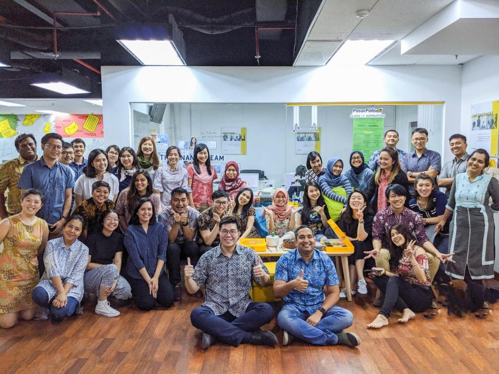 A group photo of Indonesian insurtech startup PasarPolis' team
