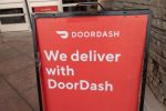 Sign reading We Deliver With Doordash, referencing the Doordash food delivery service, San Ramon, California, September 12, 2020. (Photo by Smith Collection/Gado/Getty Images)