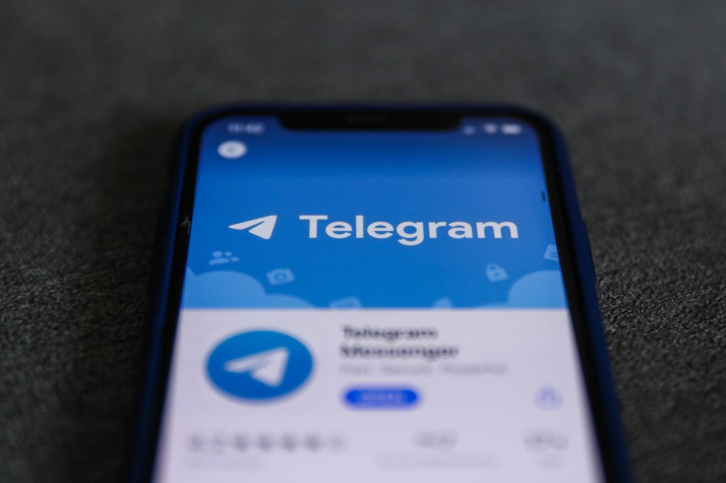 Telegram logo is seen displayed on a phone screen