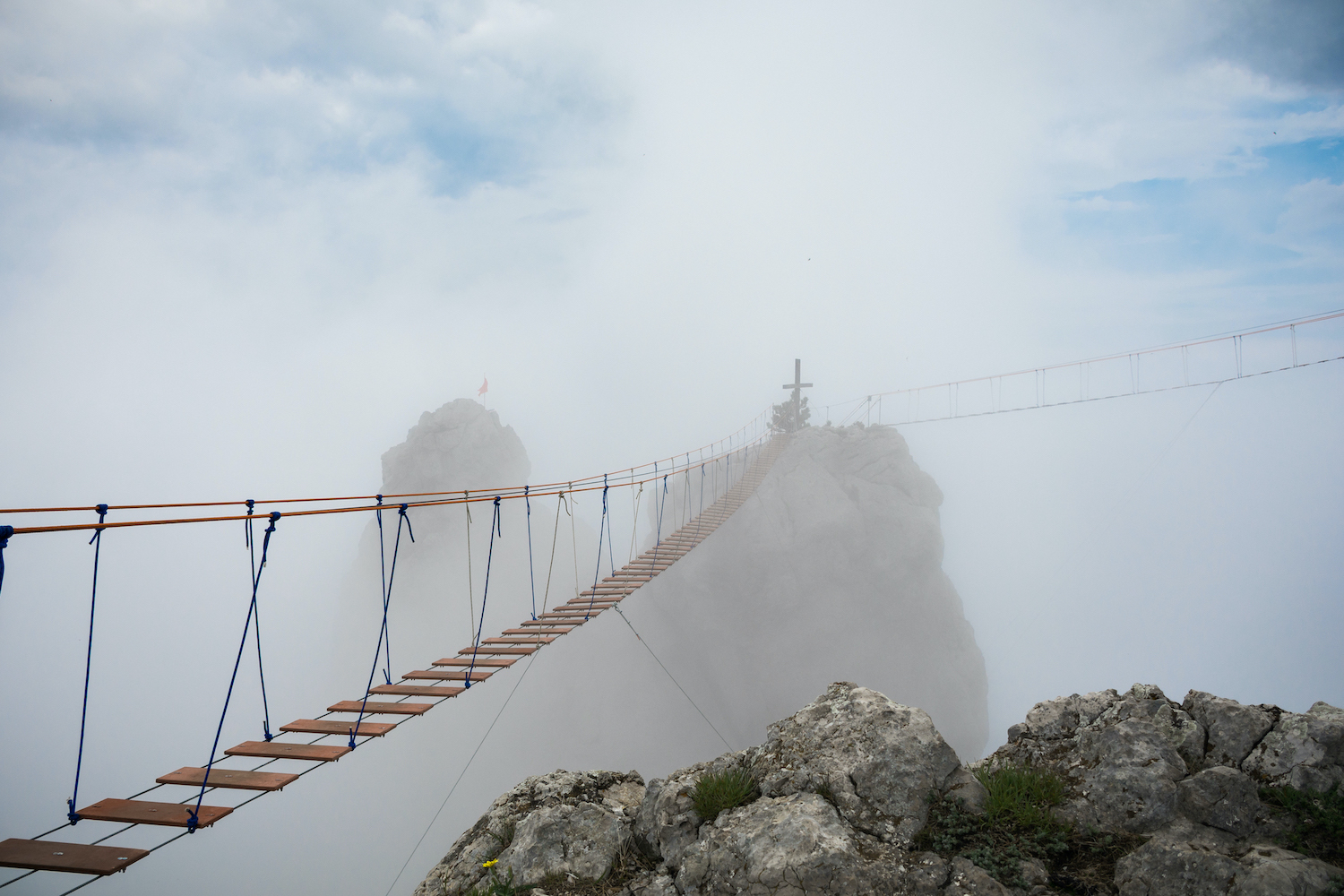 Tourist route to the top of the mountain. Rope bridge in the clouds. Crimea. Ai-Petri