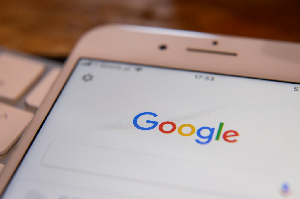 The Google Search app is seen running on an iPhone
