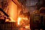 Waste steel pouring away from flask in steelworks