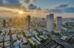 The sun setting over the mediteranean sea and the city of Tel-Aviv