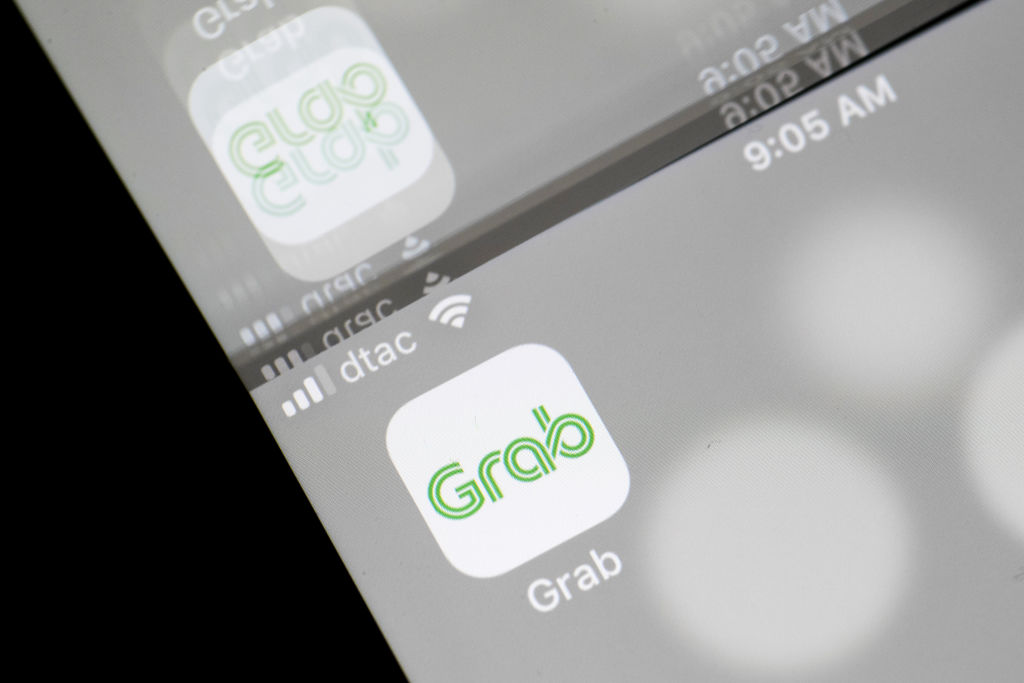 The Grab application icon is seen in an arranged photograph taken in