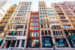 Low angle view of residential houses and shops in Tribeca, New York City, USA