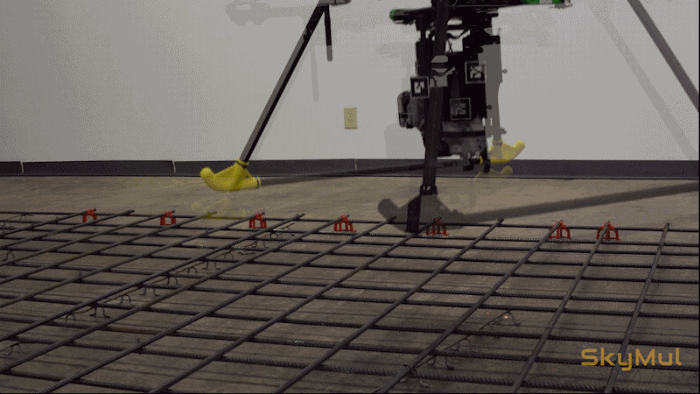 Animated image of a drone floating over rebar and tying it together at intersections.