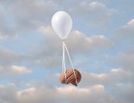 Image of a balloon carrying away a brain.