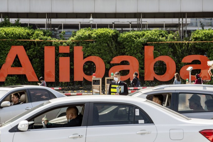 Vehicles travel past the Alibaba Group Holdings Ltd. headquarters in Hangzhou, China