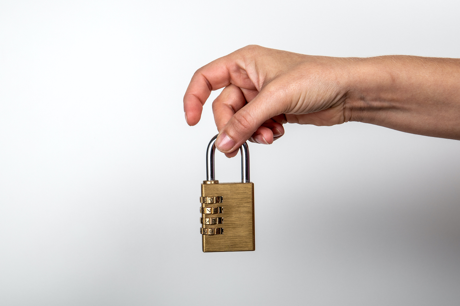 Padlock in woman's hand. Data, information, property and security on the Internet concept. White background
