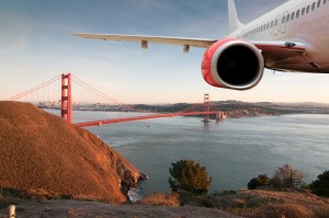 Passenger Jet Plane Flying Above San Francisco for travel concept