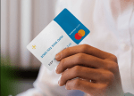 Close-up of a person's hand holding fintech startup Hatch's debit card for small businesses