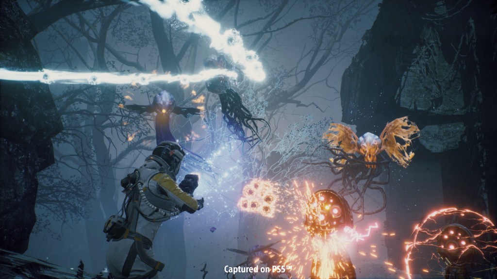 Screenshot of Returnal showing combat with alien monsters.