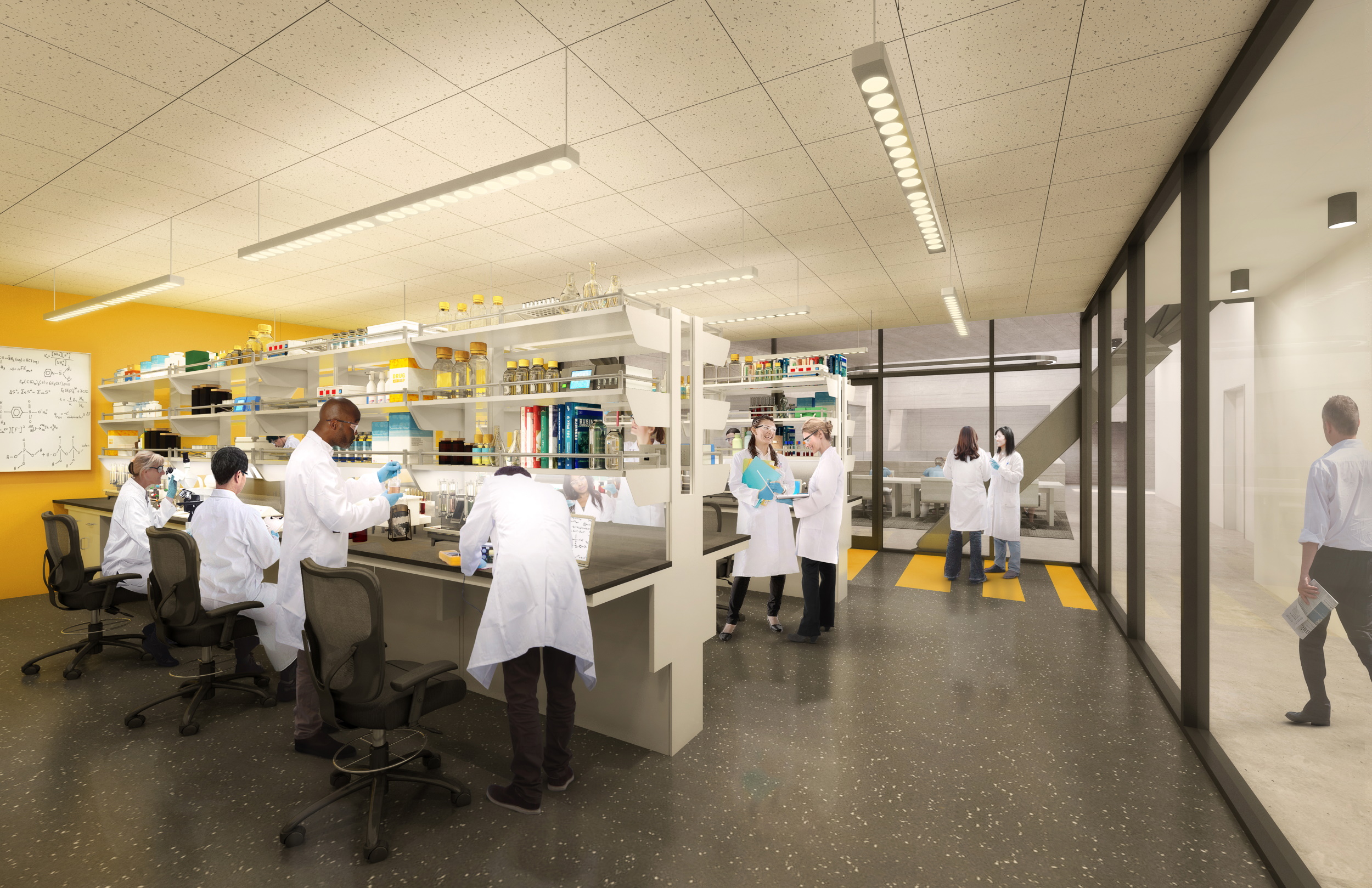 Students in a lab space working in white coats.