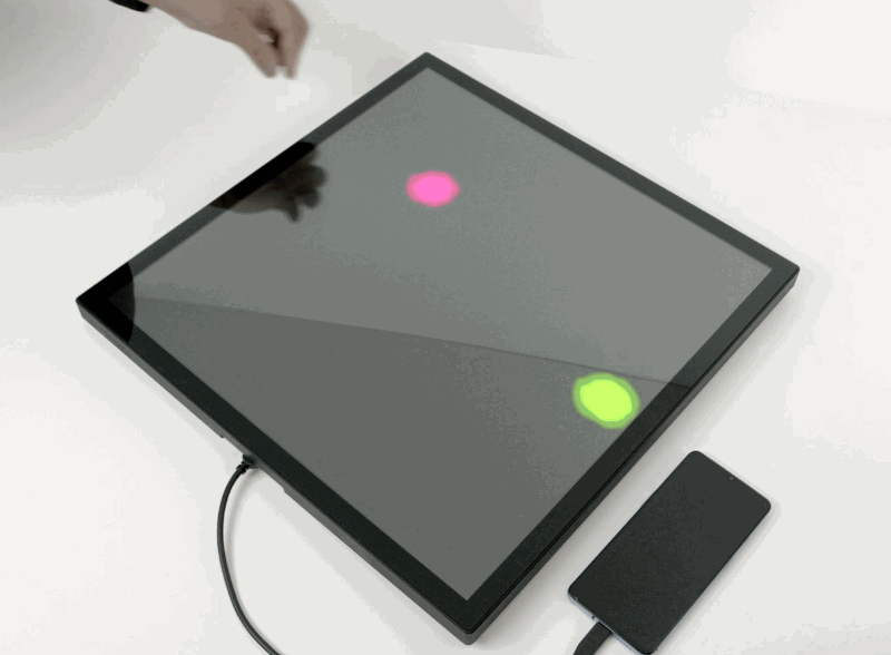 Animation of two players grabbing dots on a screen and moving them around.