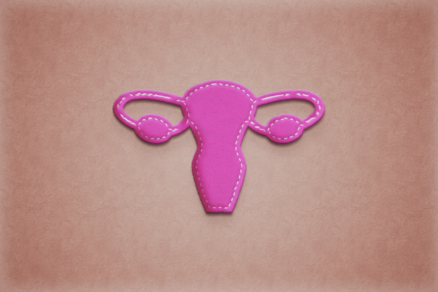 uterus un paper work.Pink backgroundArt concept of female reproductive health