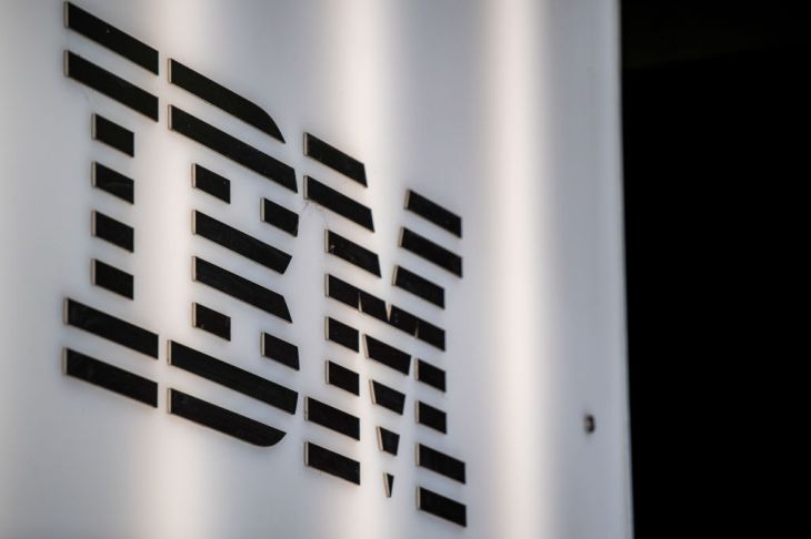Black IBM logo on a white wall.
