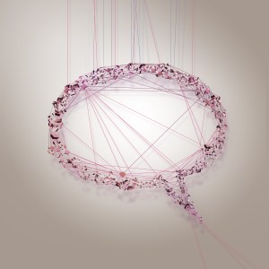 Image of a pink speech bubble tied up in string.